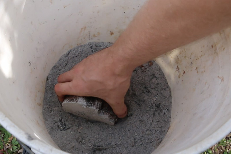 dipping yam minisetts in ashes for propagating yams